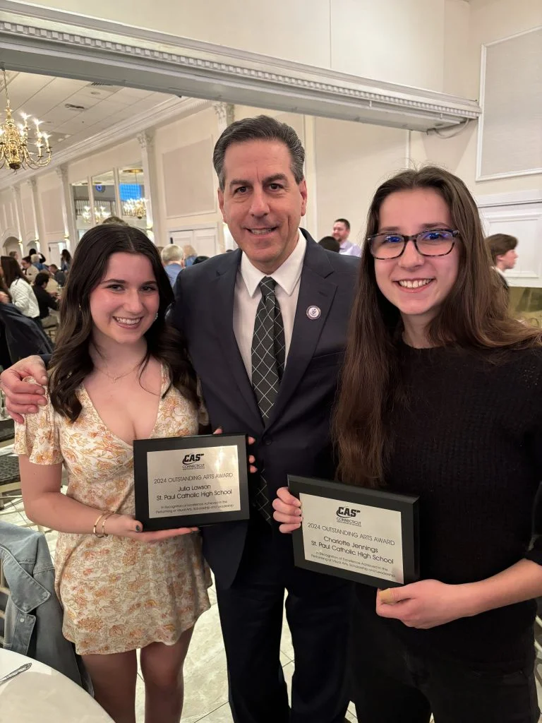 award recipients holding plaques